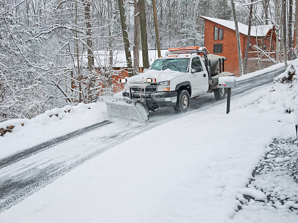istock Snowplow on an ice road with lights 157569159