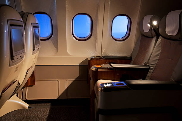 Empty business class seats in an airplane stock photo