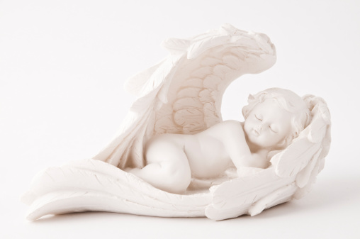 Marble angel figurine with golden wings. Christmas ornament.