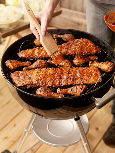 istock Pork Ribs and Chicken on a Charcoal BBQ 157569623