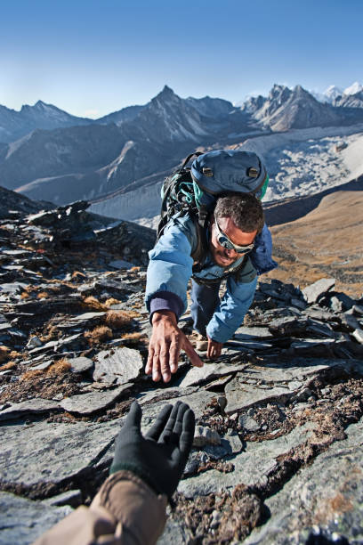 Nepali sherpa climbing in Himalayas