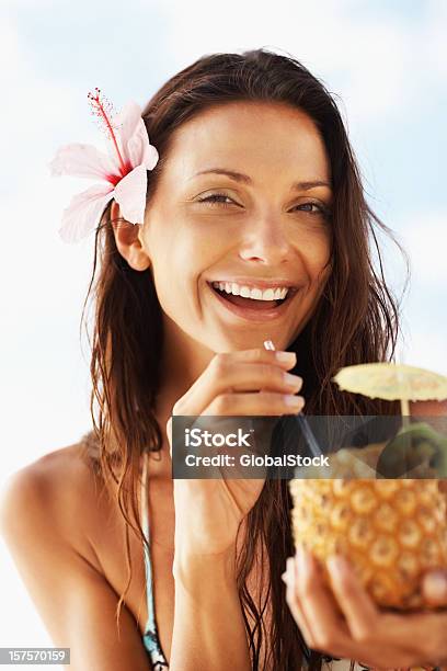 Happy Woman Drinking Pineapple Juice Stock Photo - Download Image Now - 25-29 Years, Adult, Adults Only