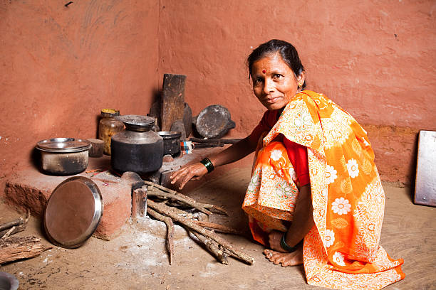 istock One Rural Indian Woman preparing food Horizontal 157570196