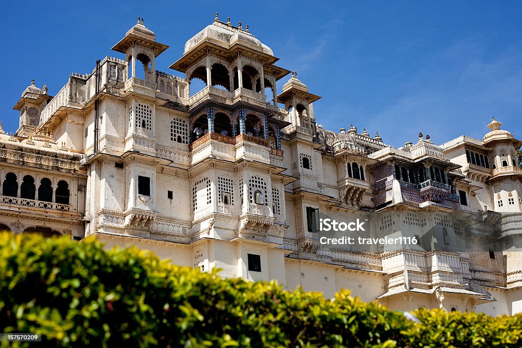 Udaipur City Palace In Rajasthan, India City Palace In Udaipur, Rajasthan, India Overlooking The Town Udaipur City Palace Stock Photo