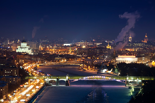 Moscow Cityscape with Kremlin, Kremlin Towers, Red Square, the Moscow Kremlin Senate building, Moscow river, churches, bridges, Cathedral of Christ the Saviour, Gorky Park and other famous buildings and placessunset