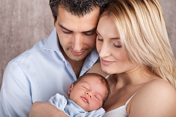 istock Young Parents with Newborn Baby 157570257