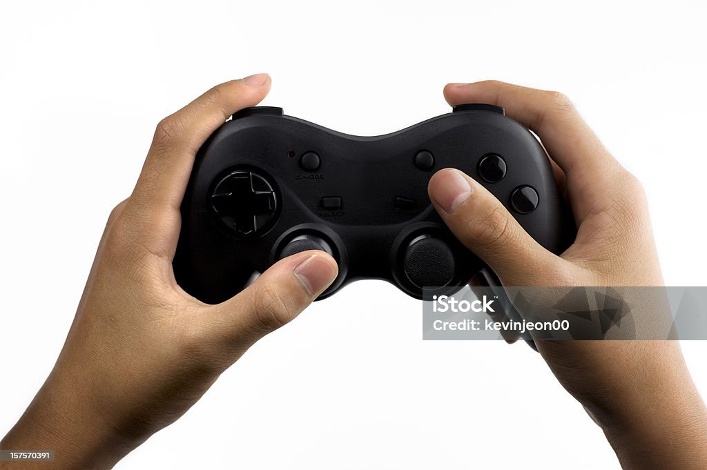 Mani su un generico gamepad - Foto stock royalty-free di Mano umana