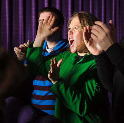 A woman standing and yelling in a concert.

[url=search/lightbox/2239437] [img]http://richlegg.com/istock/banners/movies_banner.jpg[/img][/url]
[b][url=search/lightbox/2239437]Click here to see more At The Movies images[/url][/b]
