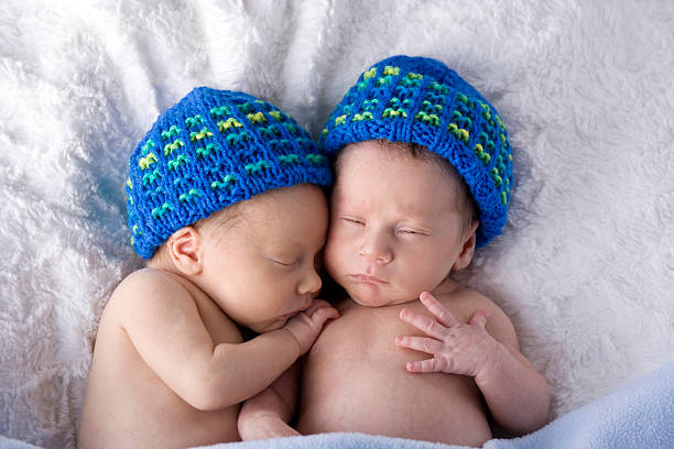 istock Newborn Twins in Colorful Knit Hats 157570473