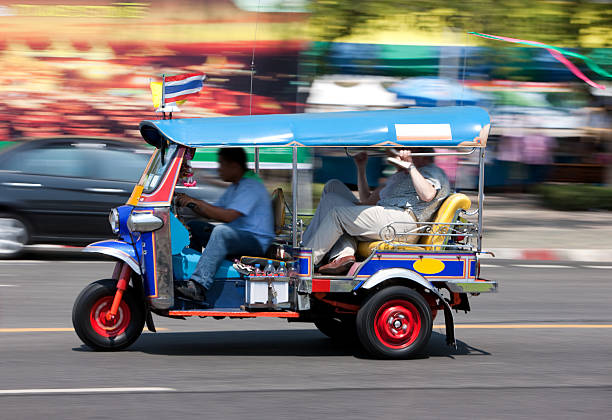 istock Bangkok Tuk-tuk with passengers. 157570528