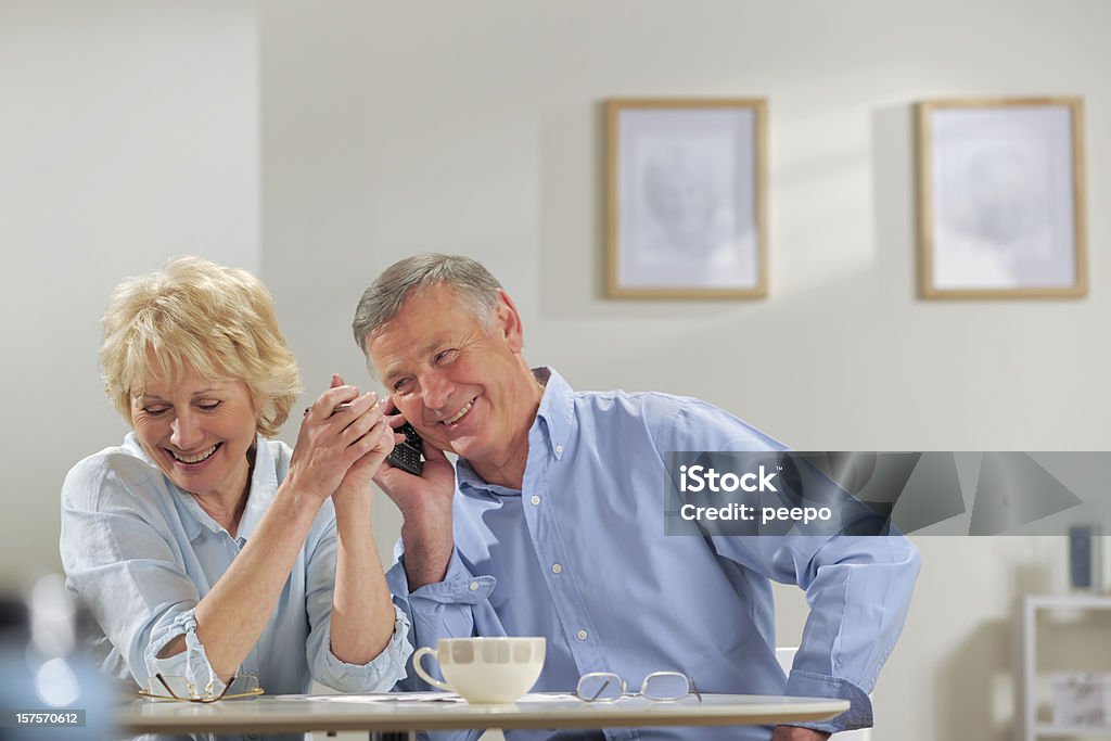 seniors on phone  60-69 Years Stock Photo