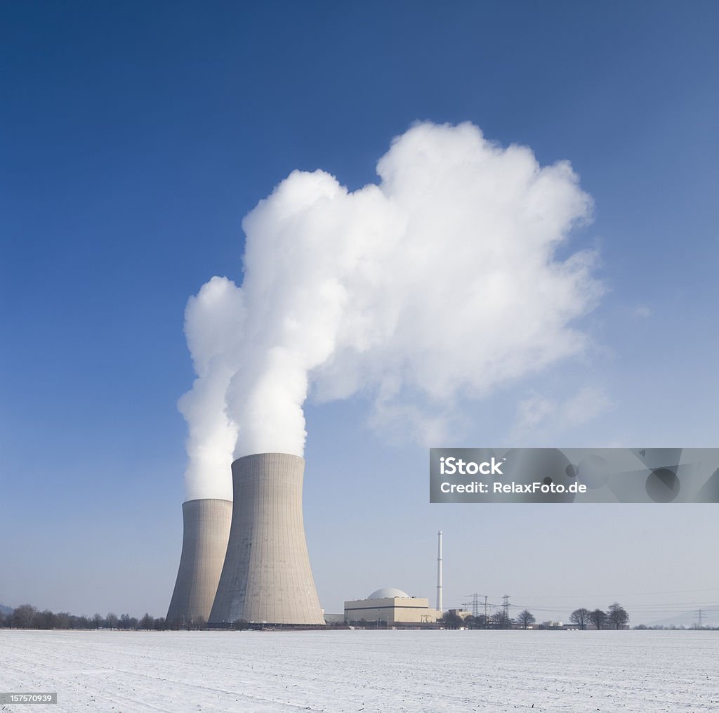 Nuclear power station with steaming cooling towers countryside in winter  Nuclear Power Station Stock Photo