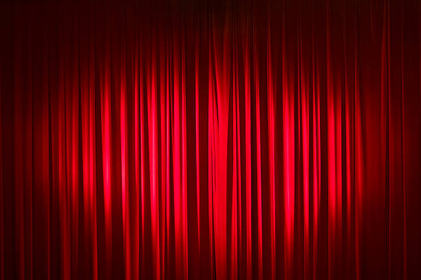 istock Spotlight On Red Velvet Stage Curtains 157571318