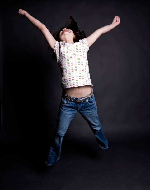 istock Huge Jump, Happy Girl in Studio 157571543