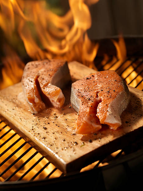 istock Raw Cedar Plank Salmon Steaks on an outdoor BBQ 157571782