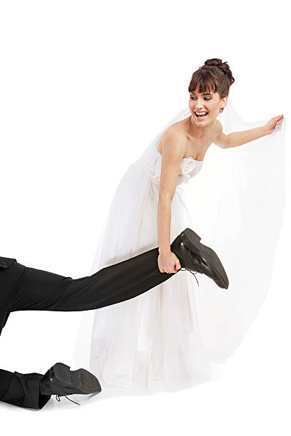 Newly wed couple,, bride caught the groom by the ankle and dragging