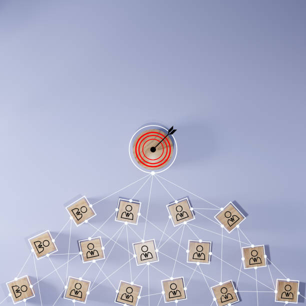 istock Red dartboard and black arrow connection linkage with human icon for customer focus target group and customer relation management concept. 1575719493