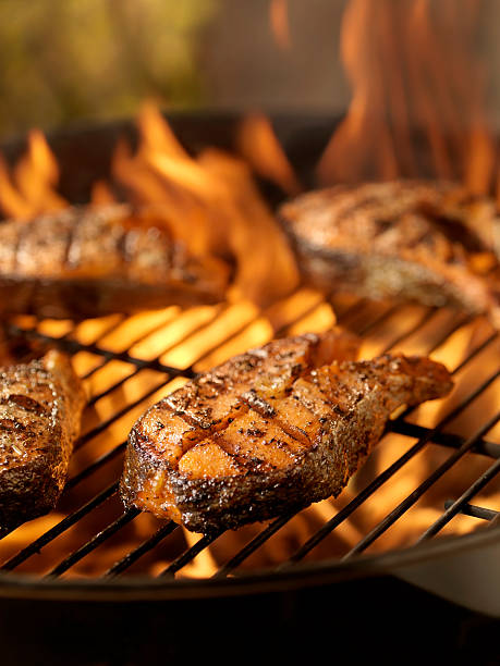 istock Salmon Steaks on an outdoor BBQ 157572132