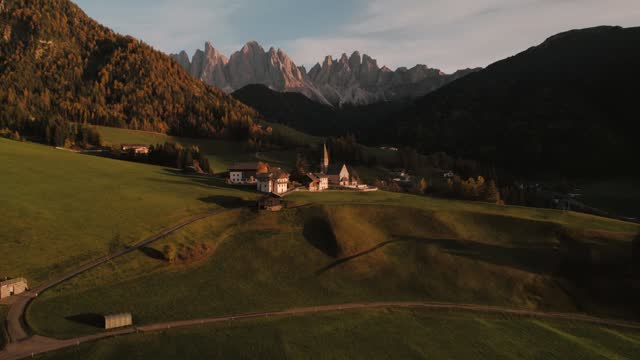 Drone footage of church in Santa Maddalena Magdalena Dolomites Italy