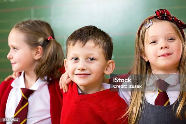 Happy School Kids Posing Together Portrait Stock Photo - Download Image Now - Girls, School Uniform, Short Hair