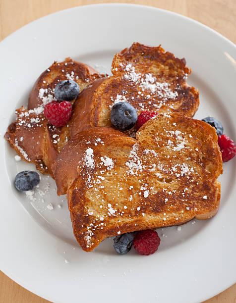 Challah French Toast with Blueberries and Raspberries  french toast stock pictures, royalty-free photos & images