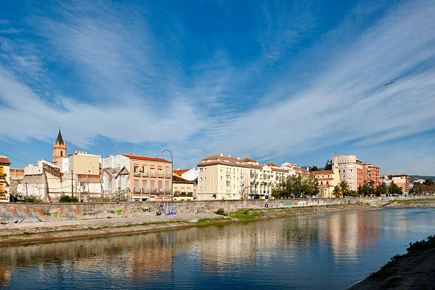 View of Malaga city and the Guadalmedina river from the right riverside with the morning sunlight, (South of Spain, Europe)