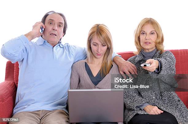 Busy Family On Red Sofà Stock Photo - Download Image Now - Family, Teenager, Television Set