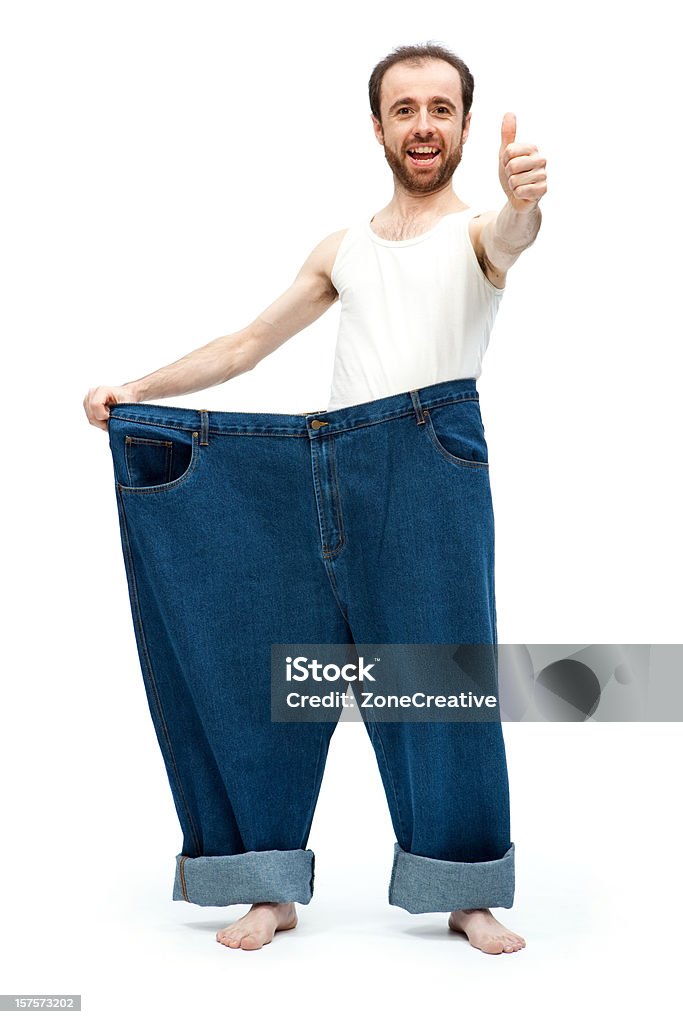 Very slim man and his large pants  Achievement Stock Photo