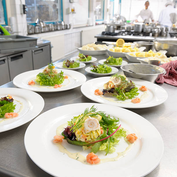 istock white plates with seafood salad ready to be served 157573259
