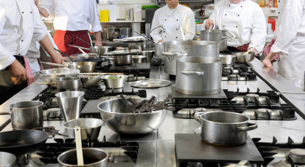 istock chefs standing around stove ready to cook dinner 157573267