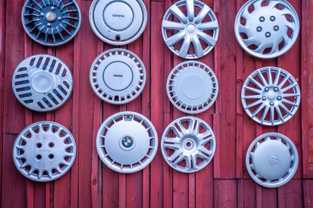 Salo, Finland – July 17, 2023: Old collectible hubcaps of the old cars hanging on a wall.