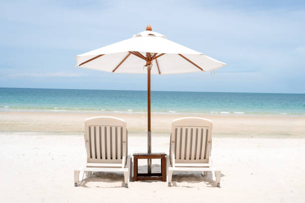istock Umbrella and Beach beds, Relax on the beach 1575770619