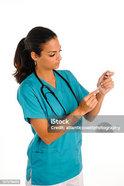 Young Nurse Giving Meds Stock Photo - Download Image Now - 20-24 Years, 20-29 Years, Adult