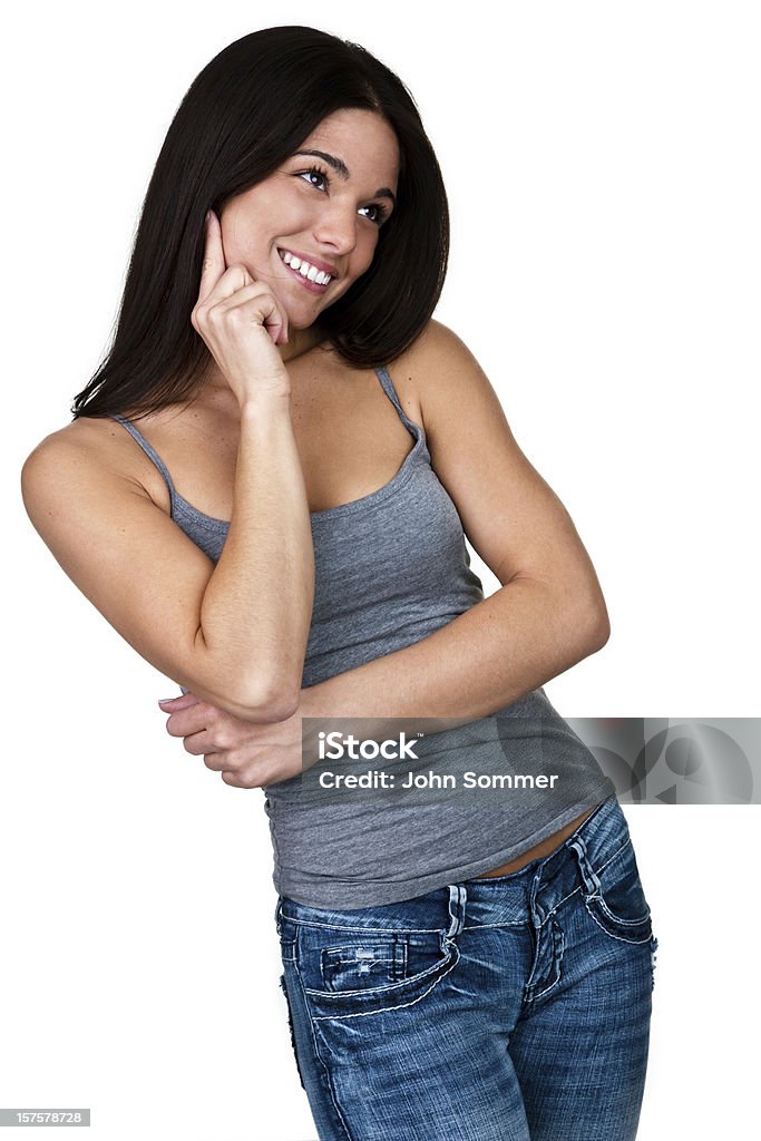 Cute woman with a cheerful expression Cute smiling woman in jeans thinking and isolated on white background 16-17 Years Stock Photo