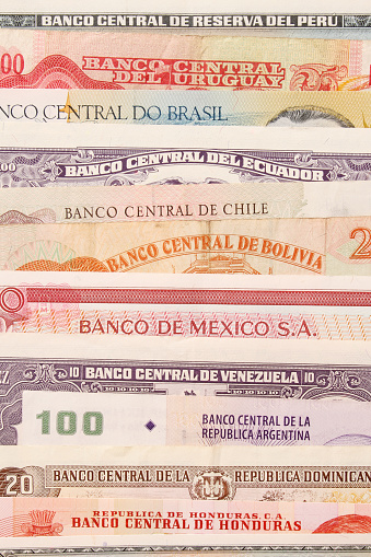 Top view of several latinamerican bills showing the bank name on top