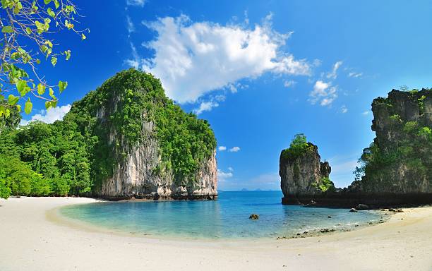 Tropical paradise lagoon beach with mountain  thailand beach stock pictures, royalty-free photos & images