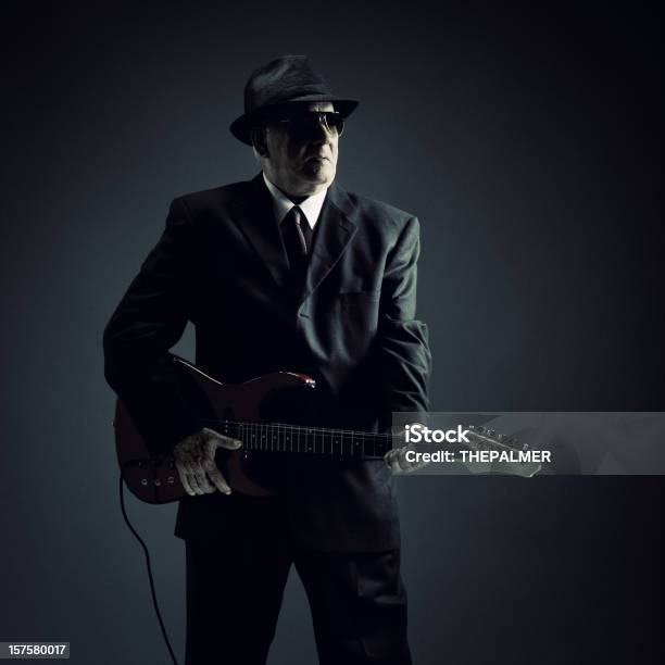 Elegant Senior Playing An Electric Guitar Stock Photo - Download Image Now - R&B, Music, Musical Instrument