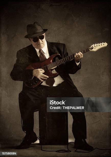 Elegant Senior Playing An Electric Guitar Stock Photo - Download Image Now - Adult, Adults Only, Authority