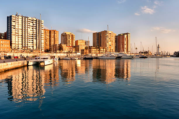 Horizontal view of the port of the Mediterranean city of Malaga, the capital of the Costa del Sol, in the evening. (Andalusia, South of Spain, Europe).