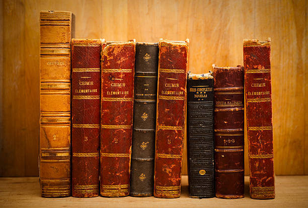 Old books Old hardcover leather books on a shelf. old book stock pictures, royalty-free photos & images