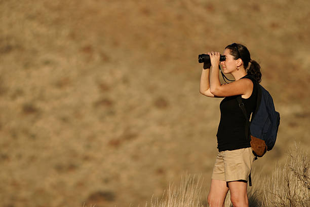 istock Hiking Woman Looking Through Binoculars 157580718