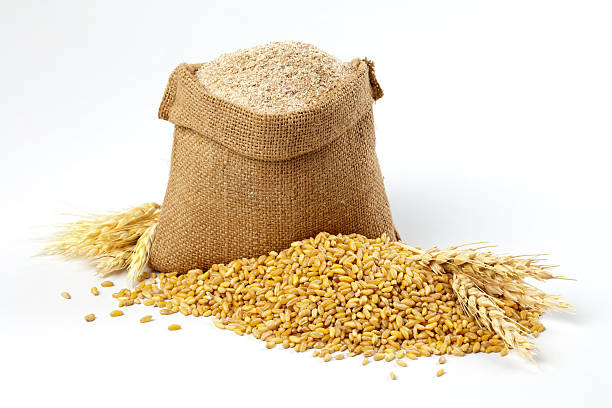 Wheat grain and bran sack Wheat grain and bran sack. wholegrain flour stock pictures, royalty-free photos & images