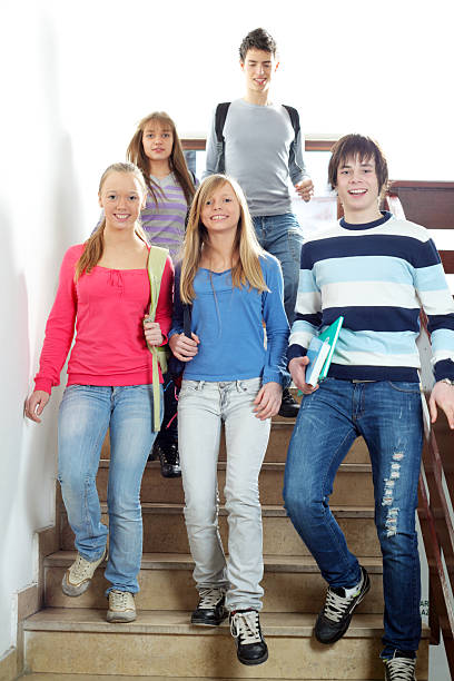 istock Students walking down the stairs in a school. 157580879
