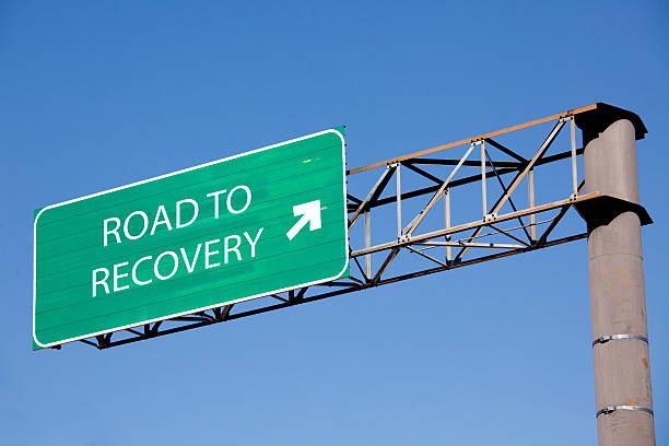 Road sign to recovery American road sign directing photos stock pictures, royalty-free photos & images