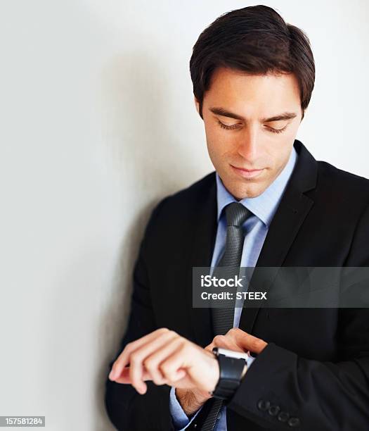 Young Business Man Looking At His Wristwatch Stock Photo - Download Image Now - 20-29 Years, 25-29 Years, Adult