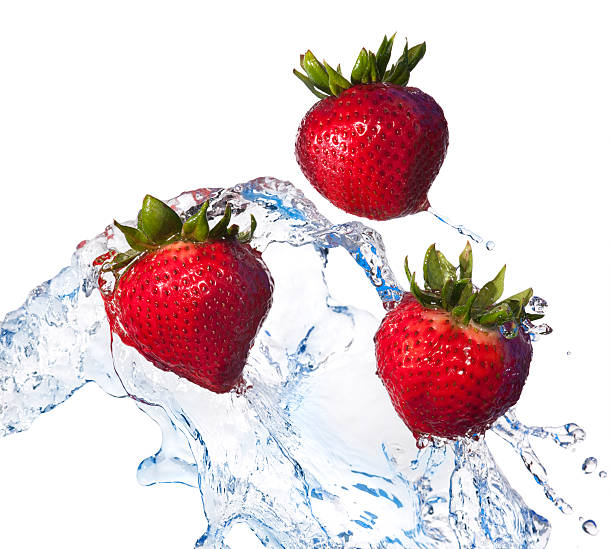 istock Fresh Fruit, Red Strawberries Tossed in Water, White Background 157581294