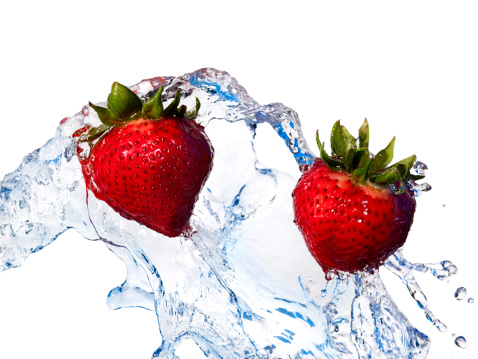 Fresh Fruit, Red Strawberries Tossed in Water, White Background