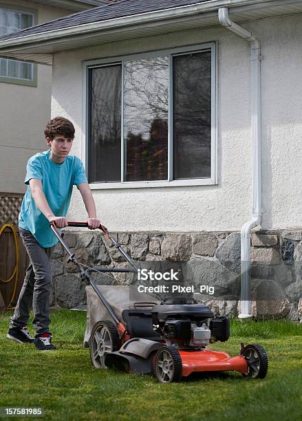 Boy Mows The Front Lawn 2 Stock Photo - Download Image Now - Mowing, Teenager, Boys