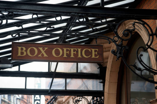 Ornate ironwork and old fashioned box office sign