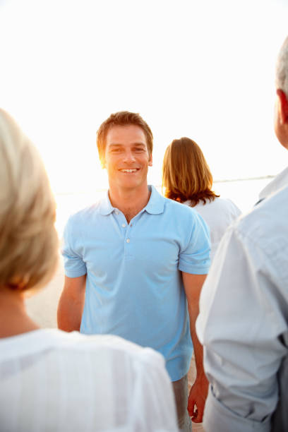 istock Handsome man standing with his family looking at sunset 157582090